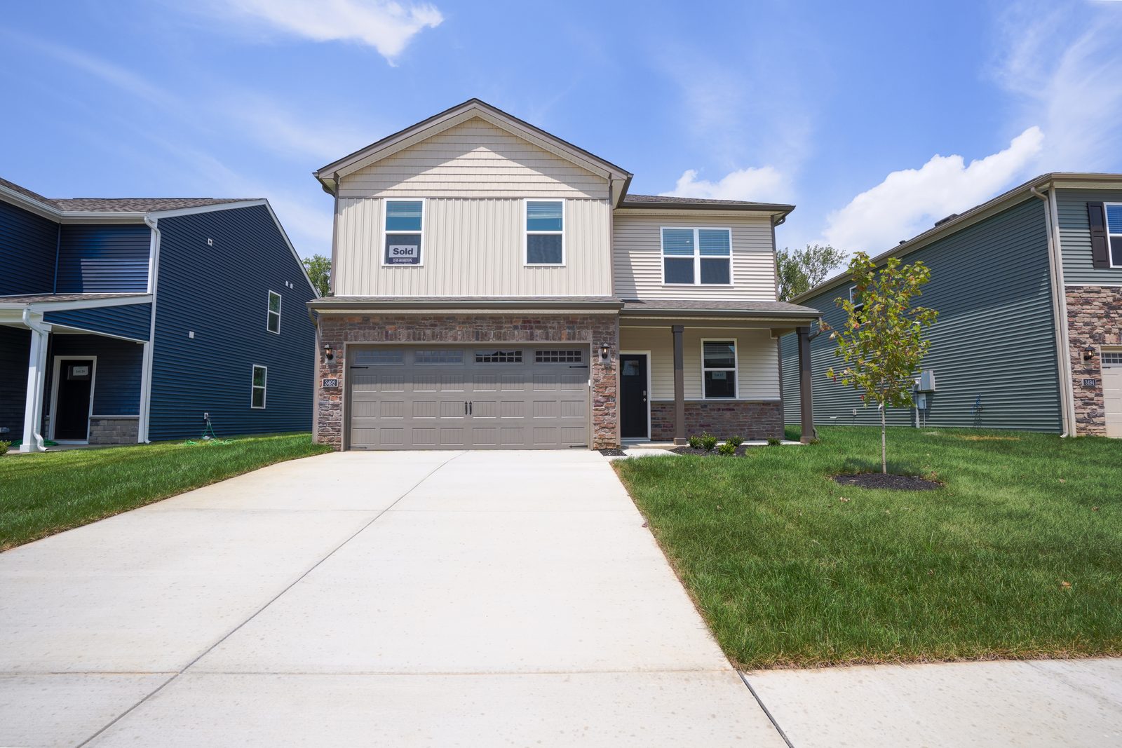 Two-story home front exterior photographed by Rez7